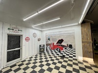 a black and white checkered floor in a garage