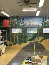 a room with a mural painted on the wall