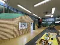 a room with a cabin painted on the wall